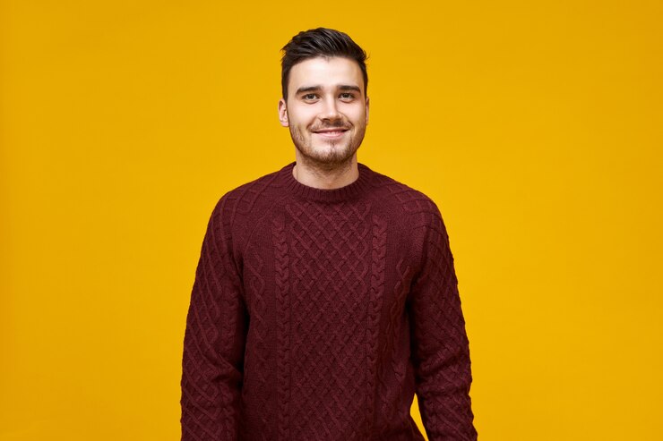 handsome-cheerful-young-man-with-stylish-haircut-dimpled-smile-posing-isolated-against-blank-yellow-wall-dressed-cozy-maroon-sweater-having-confident-look_343059-4609 handsome-cheerful-young-man-with-stylish-haircut-dimpled-smile-posing-isolated-against-blank-yellow-wall-dressed-cozy-maroon-sweater-having-confident-look_343059-4609